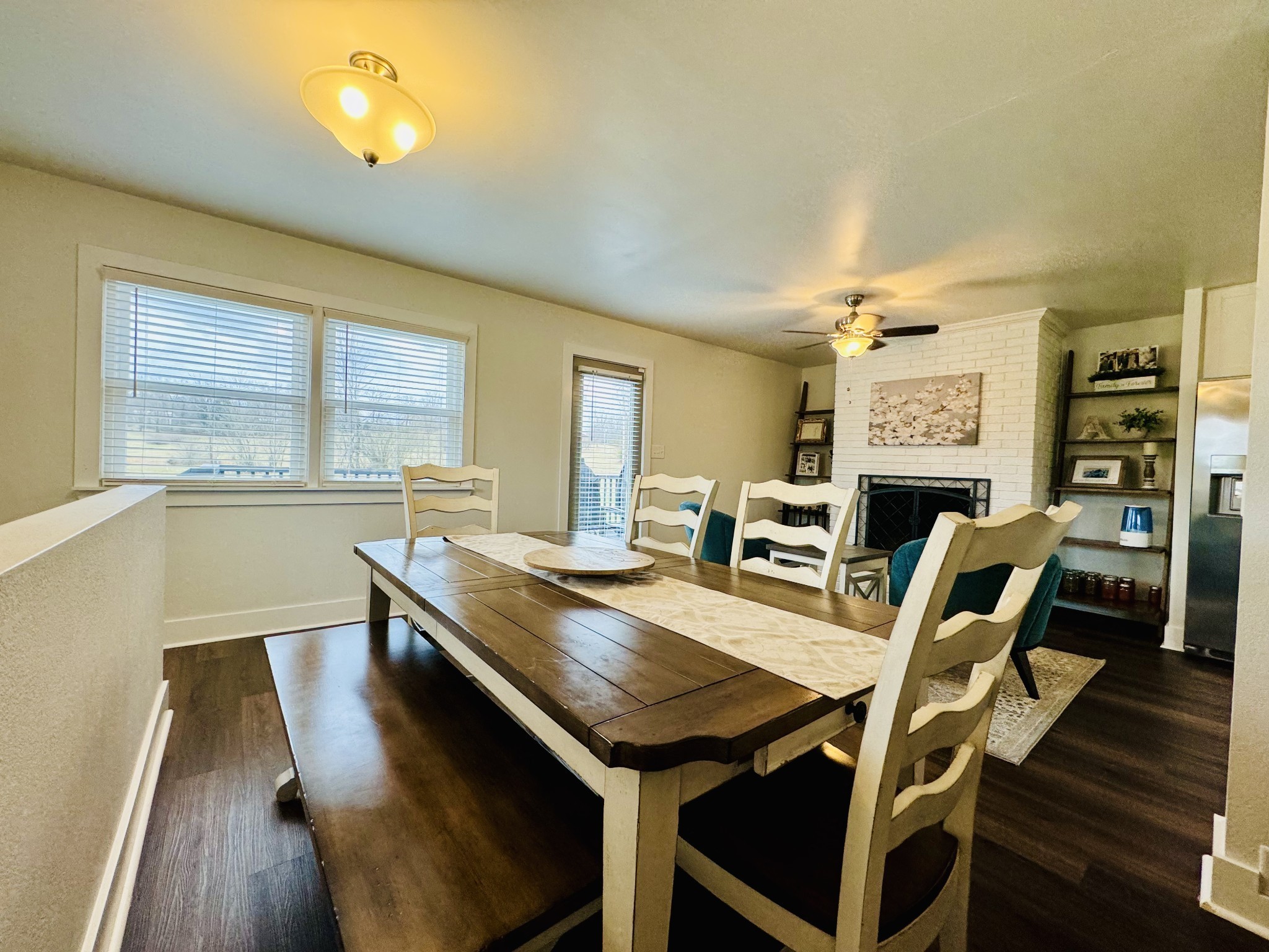 1175 Rock Church Road Dickson, TN 37055 - Photo 16 of 60 a view of a dining room with furniture and wooden floor