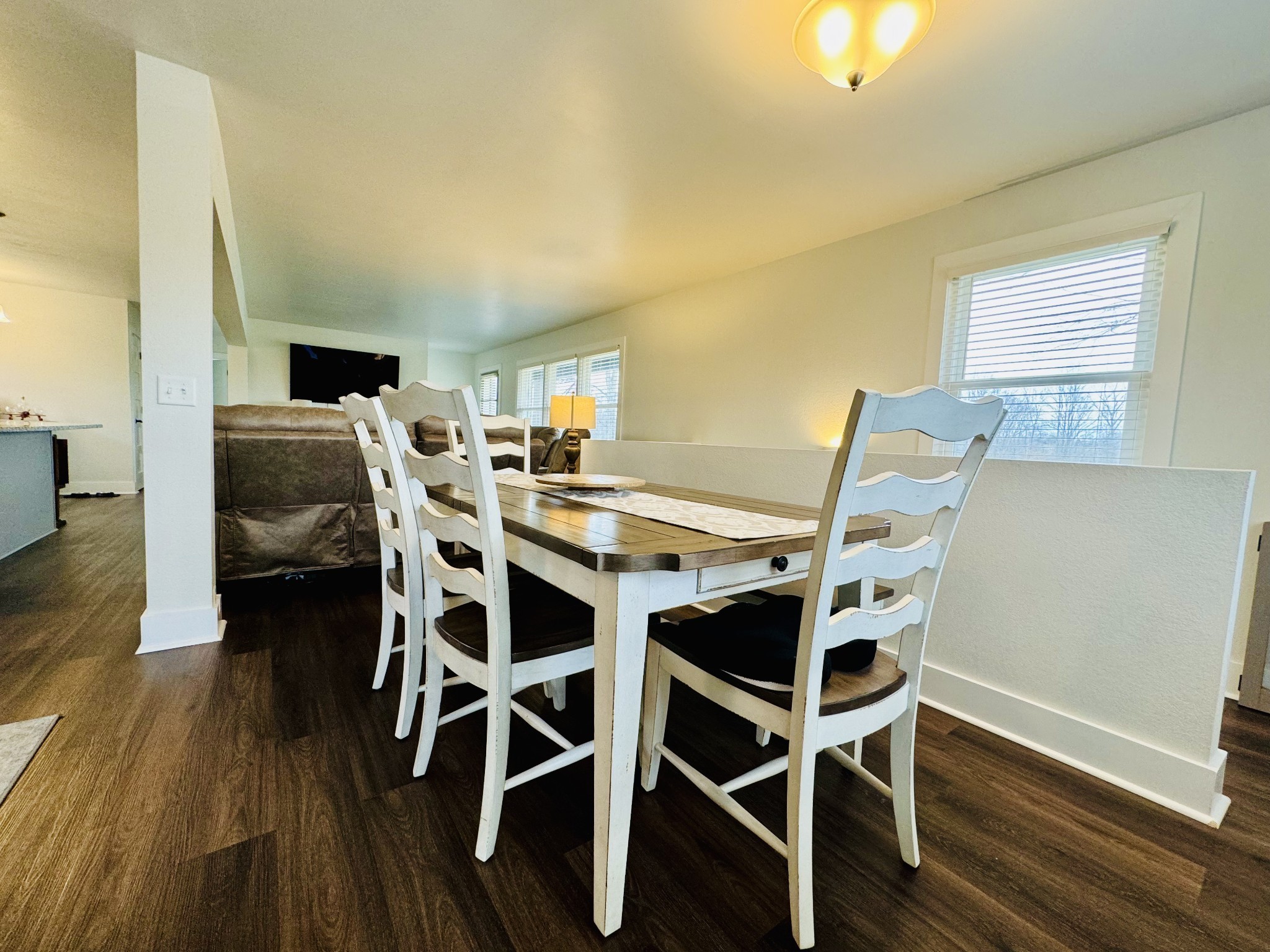1175 Rock Church Road Dickson, TN 37055 - Photo 17 of 60 a view of a dining room with furniture and wooden floor