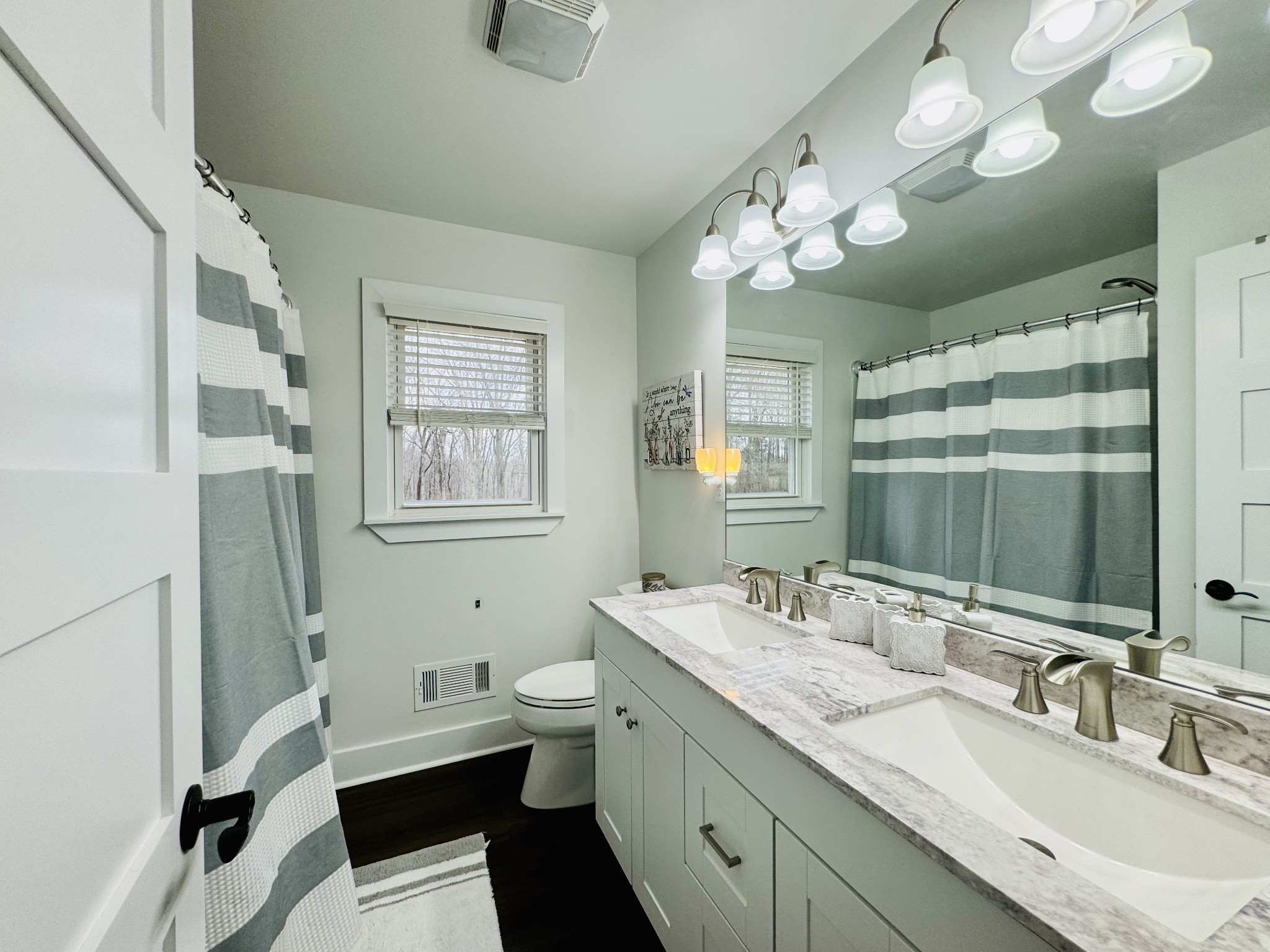 1175 Rock Church Road Dickson, TN 37055 - Photo 23 of 60 a bathroom with a double vanity sink mirror and toilet