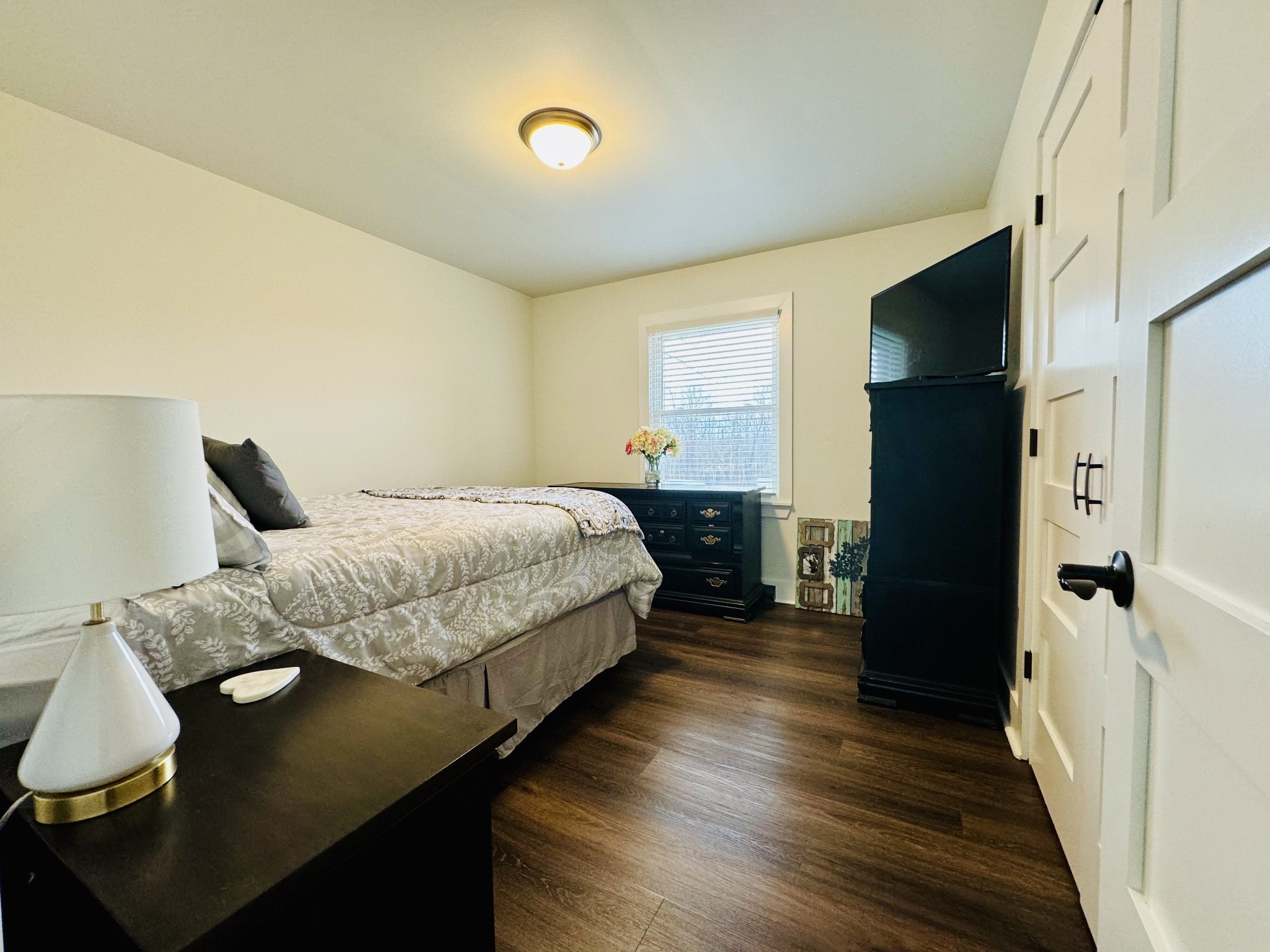 1175 Rock Church Road Dickson, TN 37055 - Photo 24 of 60 a bedroom with a bed and a flat tv screen on dresser