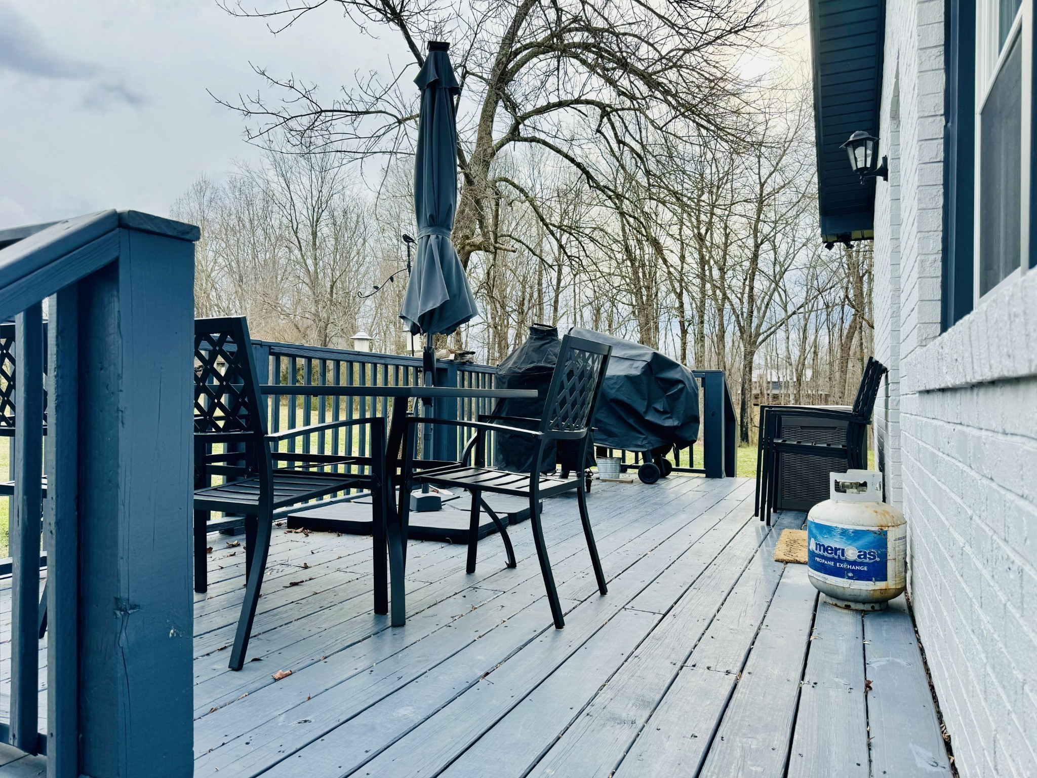 1175 Rock Church Road Dickson, TN 37055 - Photo 46 of 60 a view of a chairs and table on the wooden deck