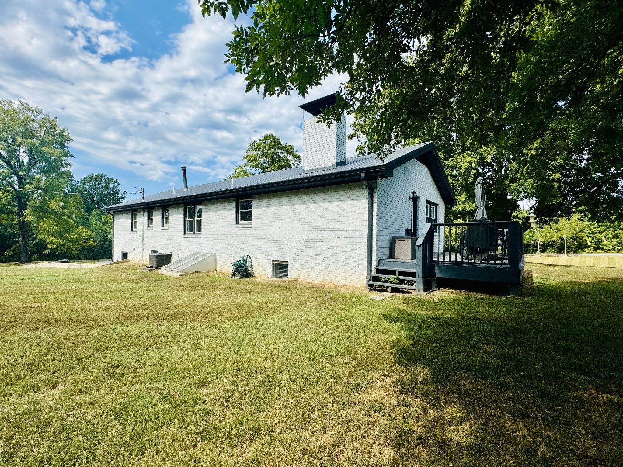 1175 Rock Church Road Dickson, TN 37055 - Photo 52 of 60 a view of a house with backyard and garden