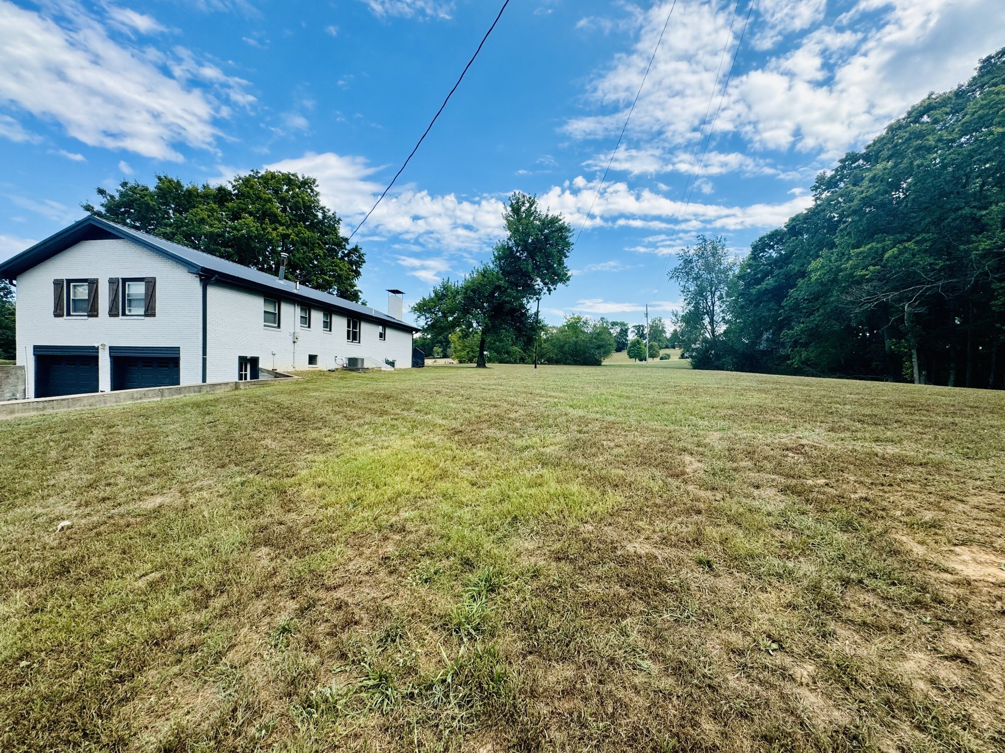 1175 Rock Church Road Dickson, TN 37055 - Photo 54 of 60 a view of a house with a yard