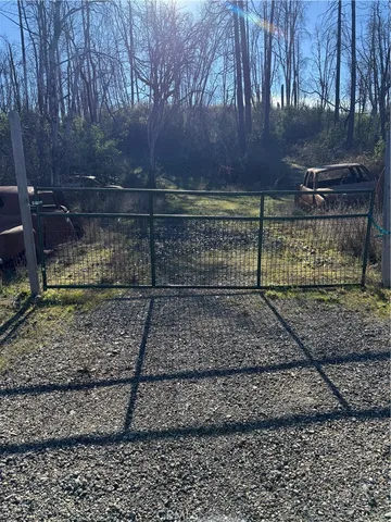 a view of a yard with a bench
