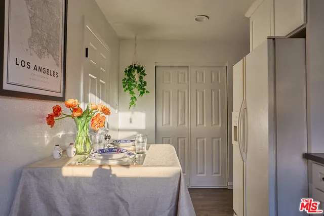 a dining room with furniture and wooden floor