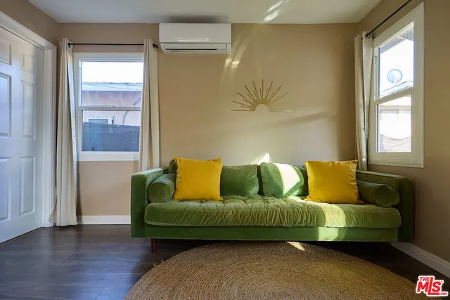 a living room with a couch and a window