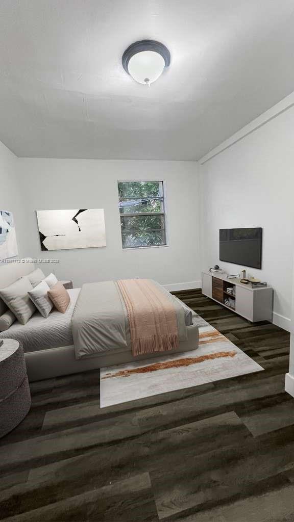 413 Northwest 33rd Street, Unit B Miami, FL 33127 - Photo 11 of 13 a bedroom with a bed and a tv
