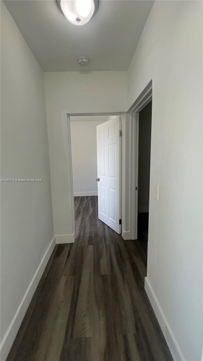 413 Northwest 33rd Street, Unit B Miami, FL 33127 - Photo 9 of 13 a view of wooden floor in a room