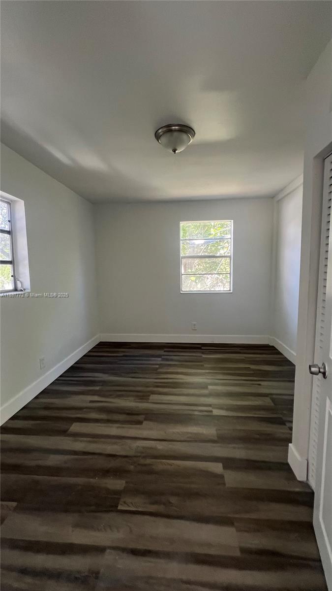 413 Northwest 33rd Street, Unit B Miami, FL 33127 - Photo 10 of 13 a view of empty room with window and fireplace