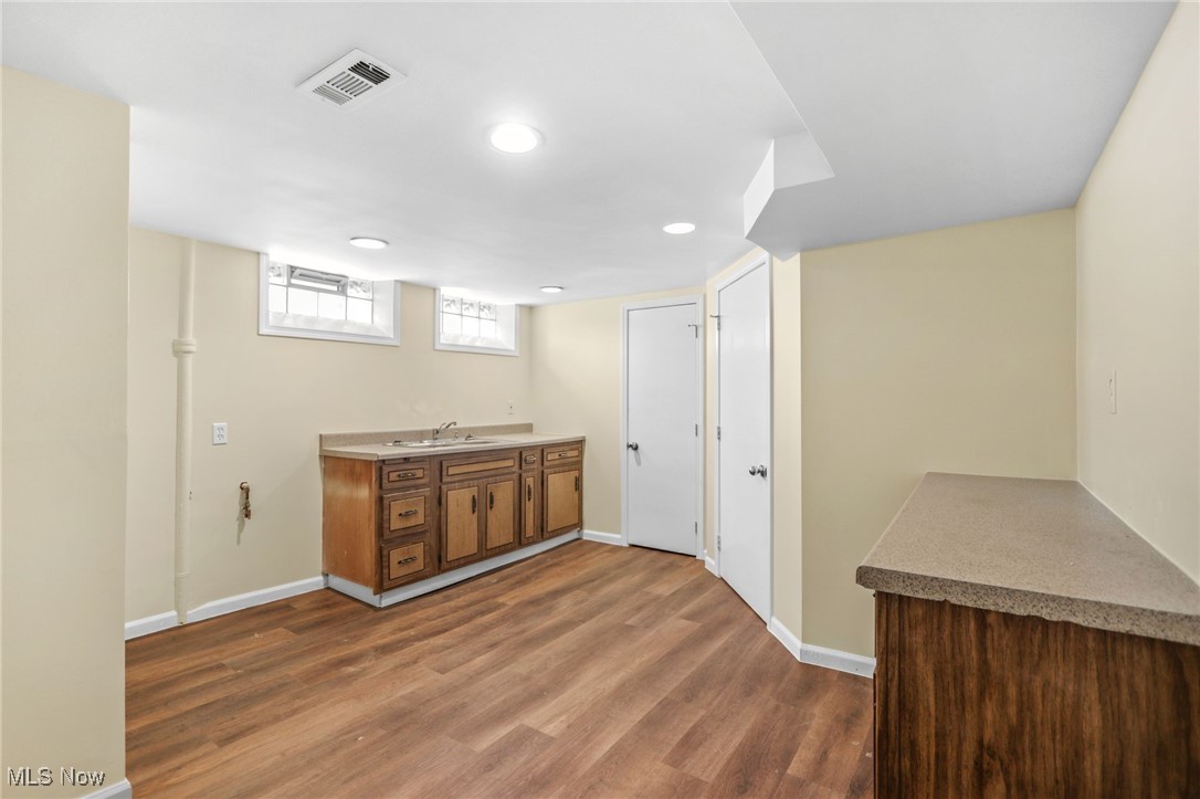 3205 George Avenue Cleveland, OH 44134 - Photo 25 of 32 Bar with dark wood-style floors and recessed lighting