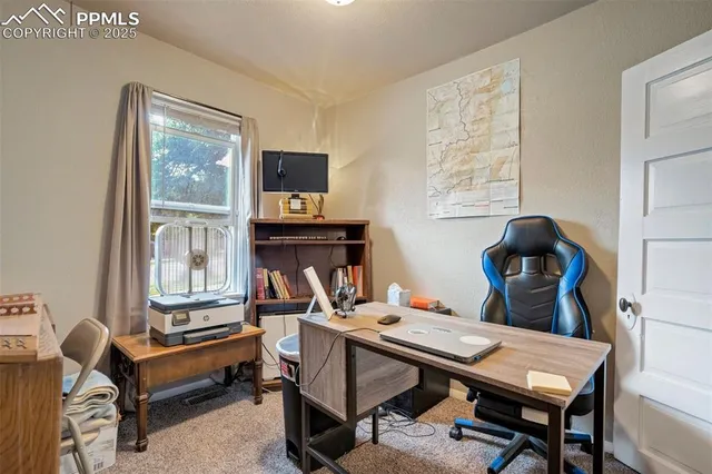 a view of a workspace with furniture