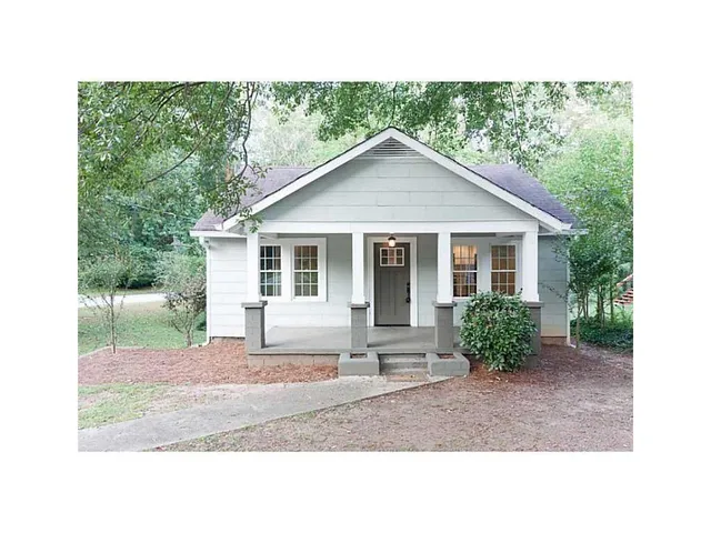 a house view with a garden space