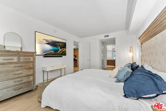 a bathroom with a double vanity sink mirror and shower