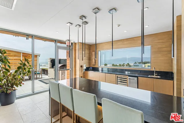 a kitchen with a refrigerator stove and oven