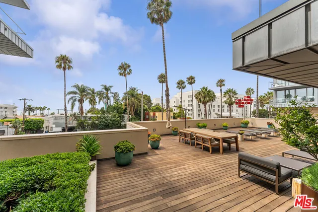 a lobby with furniture and a rug