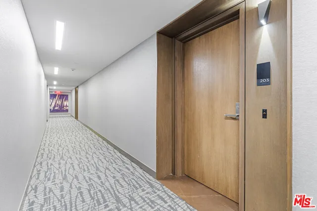 a kitchen with stainless steel appliances granite countertop a sink refrigerator and microwave