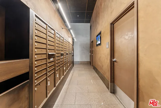 a view of a house with a yard and potted plants