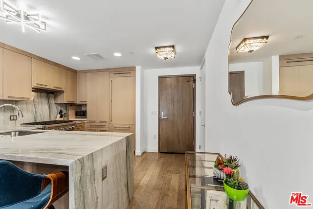 a kitchen with a stove top oven sink and cabinets