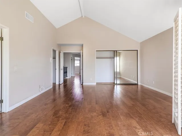 a spacious bathroom with a tub sink and mirror
