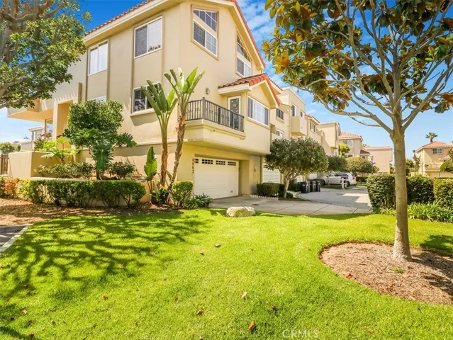 a view of a swimming pool with plants and trees