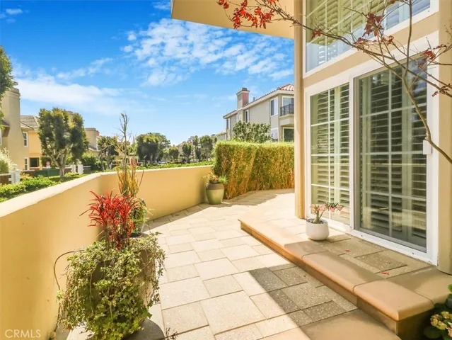 a view of a balcony with a potted plants
