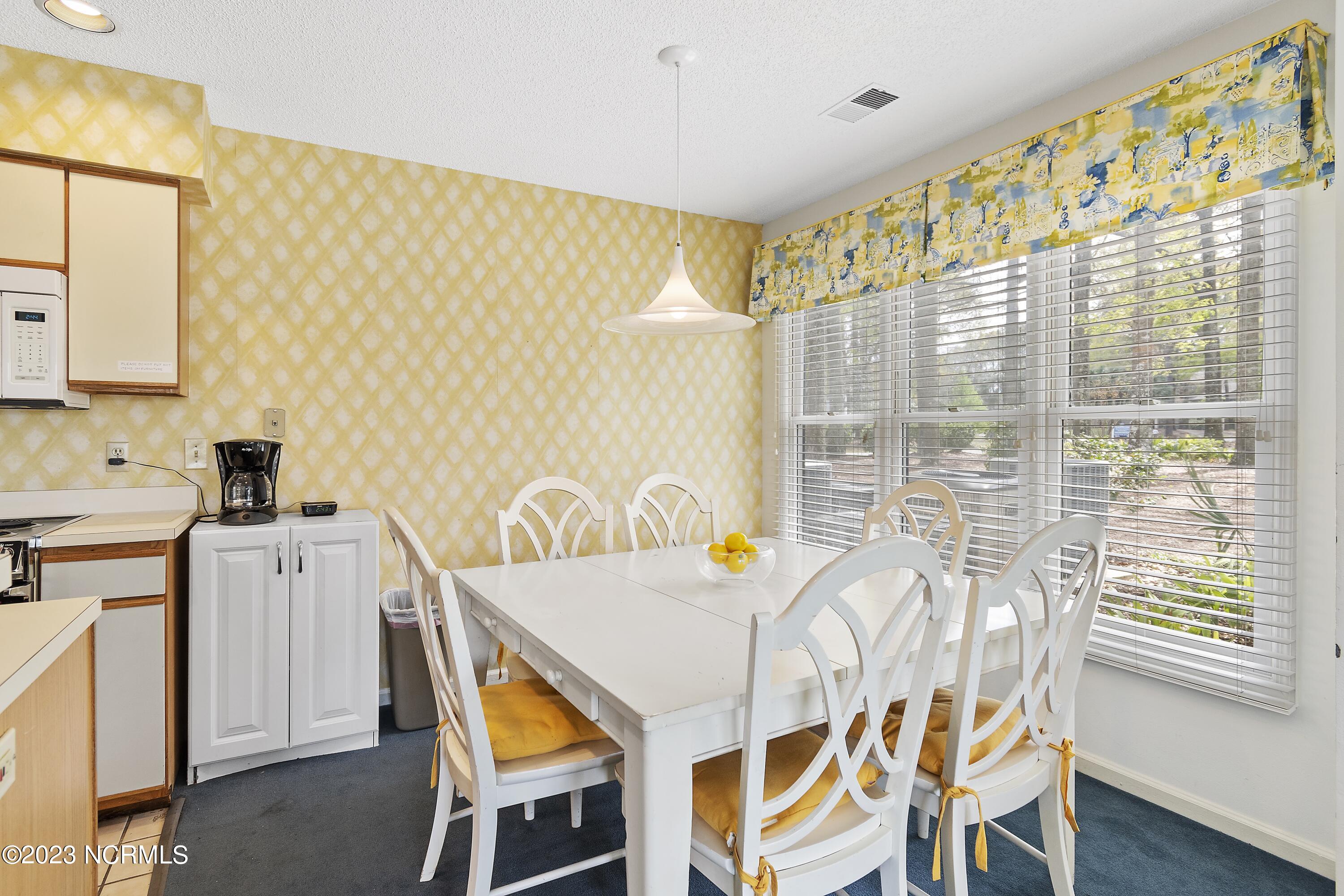 215 Clubhouse Road, Unit 1 Sunset Beach, NC 28468 - Photo 10 of 57 Dining area