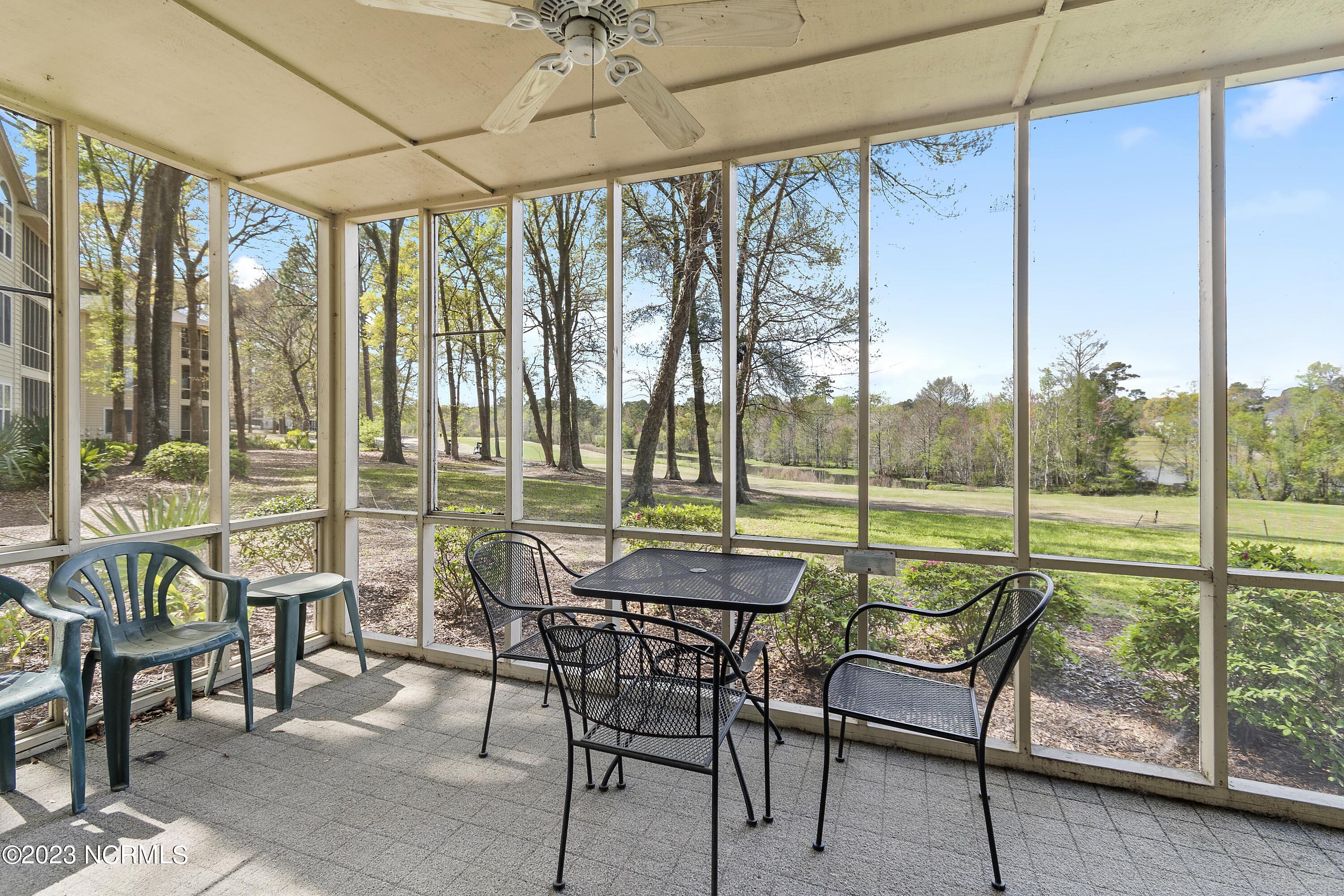 215 Clubhouse Road, Unit 1 Sunset Beach, NC 28468 - Photo 18 of 57 Screened porch