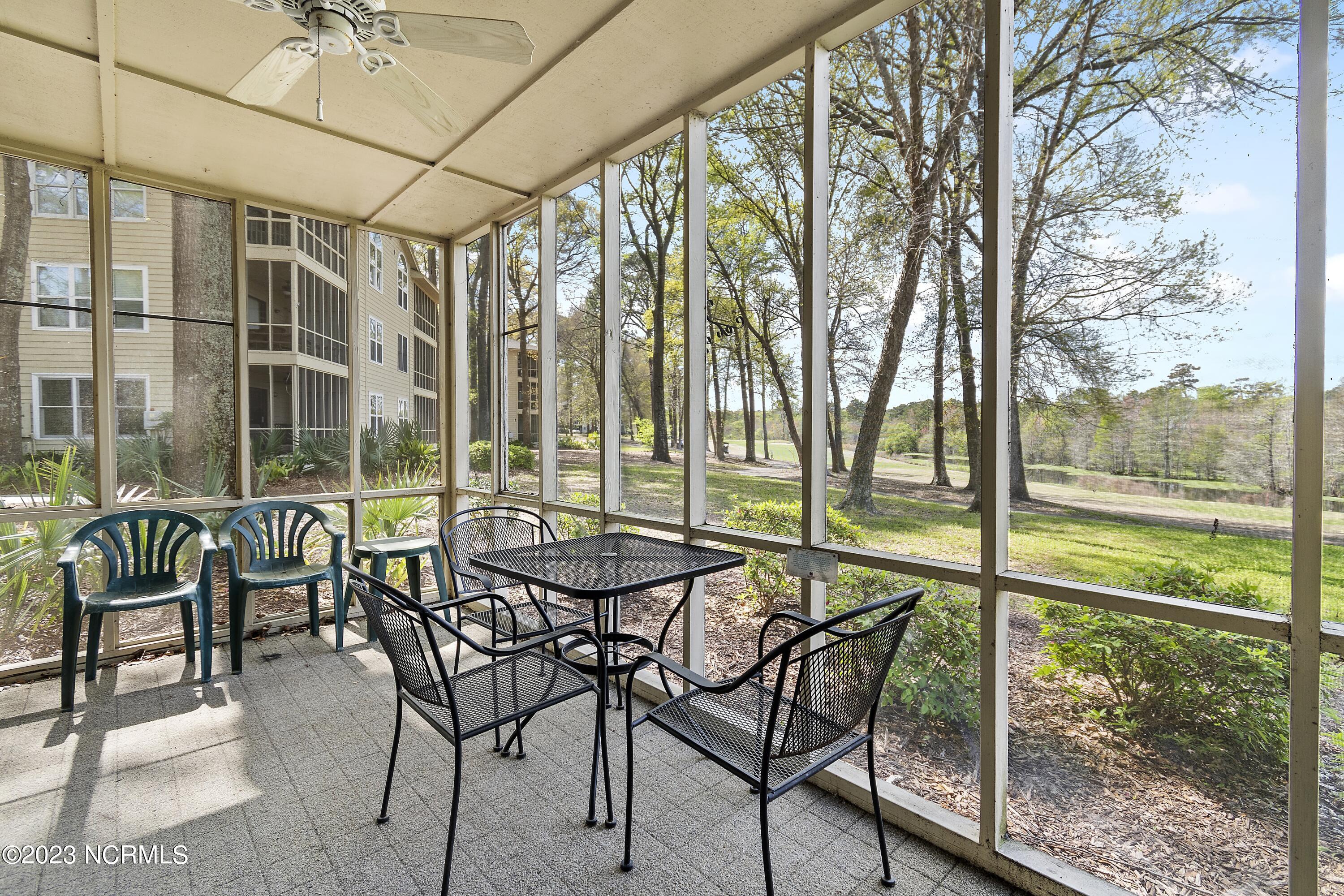 215 Clubhouse Road, Unit 1 Sunset Beach, NC 28468 - Photo 19 of 57 Screened porch