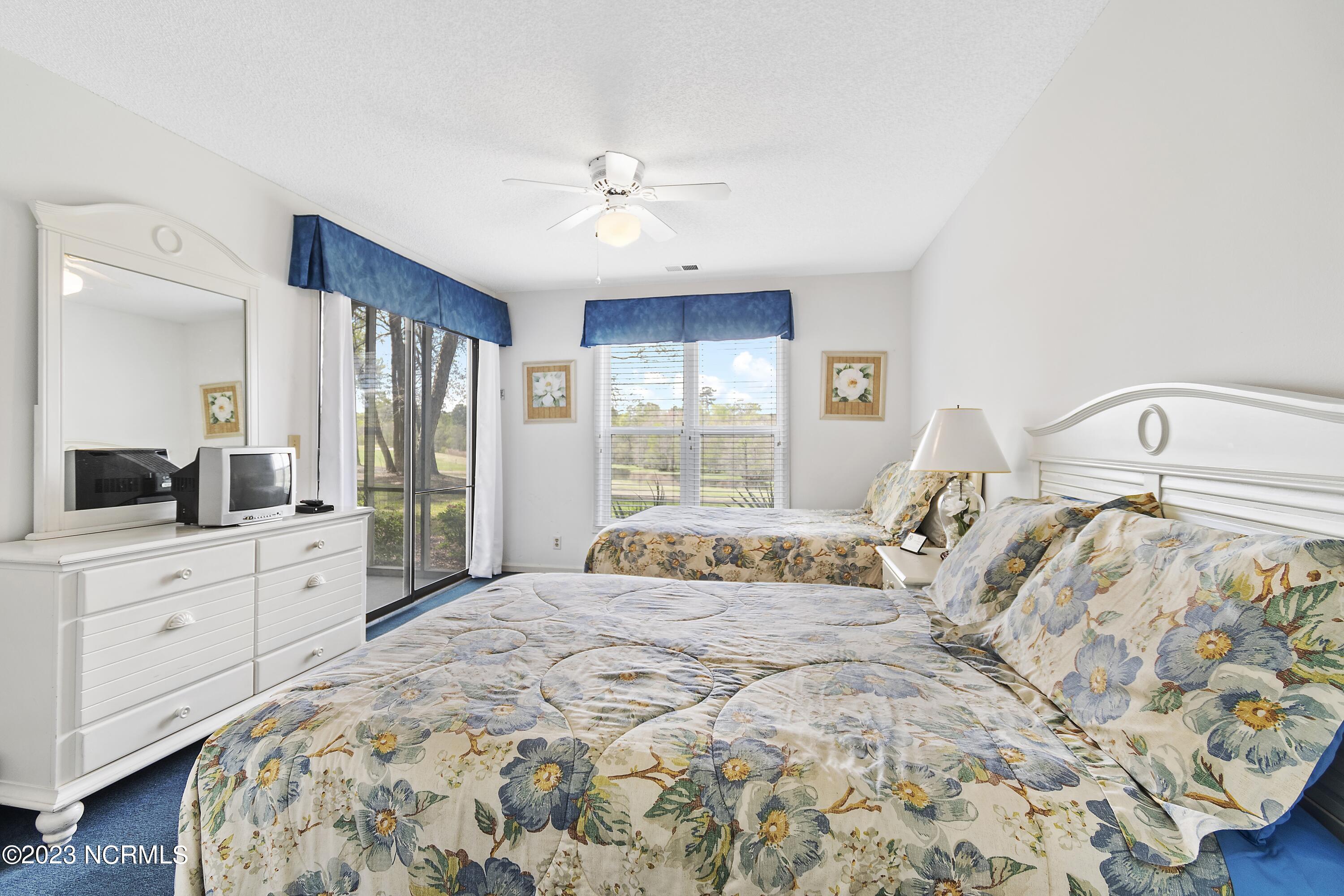 215 Clubhouse Road, Unit 1 Sunset Beach, NC 28468 - Photo 22 of 57 Master bedroom