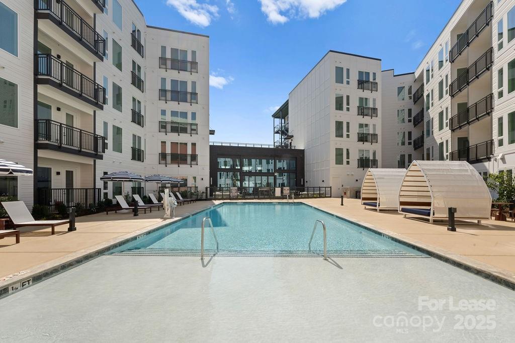 a view of pool with outdoor seating