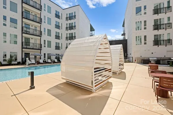 a kitchen with a table and chairs