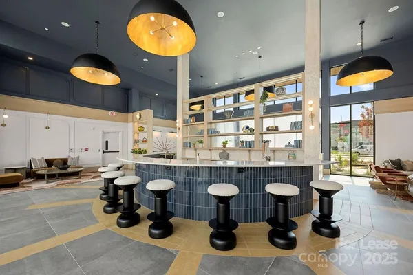 a view of living room with furniture and floor to ceiling window