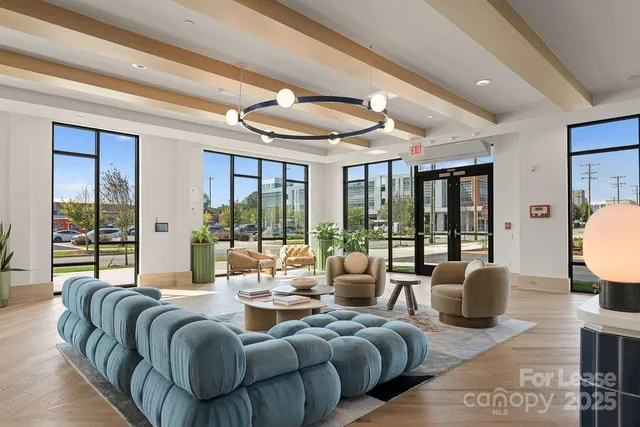 a kitchen with stainless steel appliances granite countertop a sink a stove and refrigerator