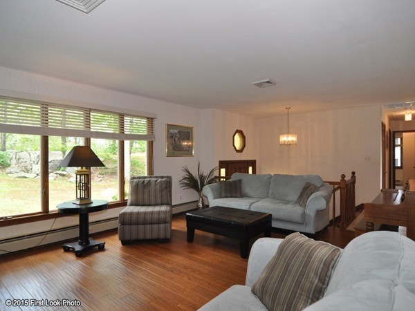 246 Bulgarmarsh Road Tiverton, RI 02878 - Photo 11 of 30 a living room with furniture and a large window