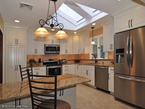 246 Bulgarmarsh Road Tiverton, RI 02878 - Photo 13 of 30 a kitchen with stainless steel appliances granite countertop a stove refrigerator and a sink