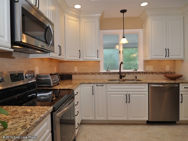 246 Bulgarmarsh Road Tiverton, RI 02878 - Photo 14 of 30 a kitchen with stainless steel appliances granite countertop a sink a stove and a microwave