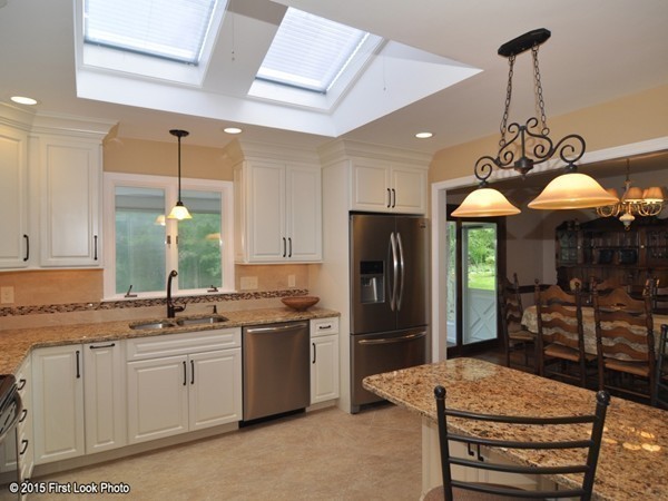 246 Bulgarmarsh Road Tiverton, RI 02878 - Photo 15 of 30 a kitchen with stainless steel appliances granite countertop a sink a stove a refrigerator and island