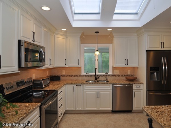 246 Bulgarmarsh Road Tiverton, RI 02878 - Photo 16 of 30 a kitchen with stainless steel appliances granite countertop a sink stove and refrigerator