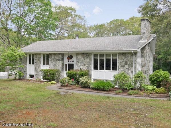 246 Bulgarmarsh Road Tiverton, RI 02878 - Photo 2 of 30 a front view of a house with a yard and potted plants