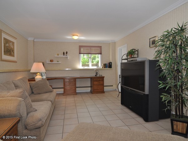 246 Bulgarmarsh Road Tiverton, RI 02878 - Photo 23 of 30 a living room with furniture and a fireplace