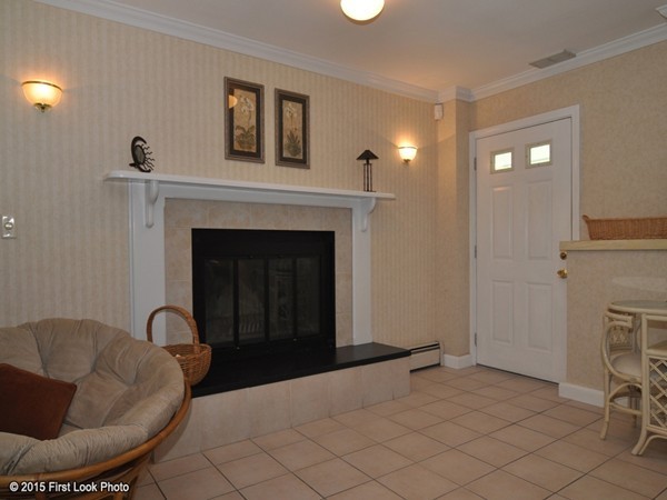 246 Bulgarmarsh Road Tiverton, RI 02878 - Photo 24 of 30 a living room with furniture and a fireplace
