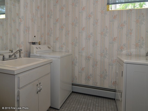 246 Bulgarmarsh Road Tiverton, RI 02878 - Photo 27 of 30 a bathroom with a sink a vanity and a window