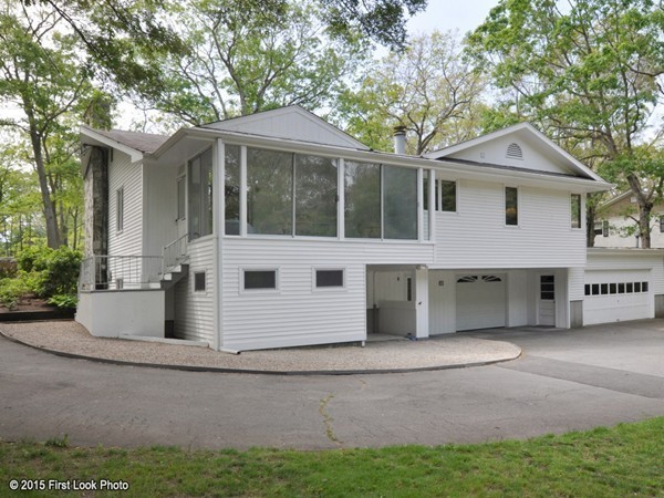 246 Bulgarmarsh Road Tiverton, RI 02878 - Photo 4 of 30 a front view of a house with a yard and garage