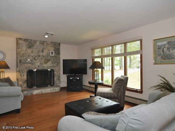 246 Bulgarmarsh Road Tiverton, RI 02878 - Photo 9 of 30 a living room with furniture and a flat screen tv