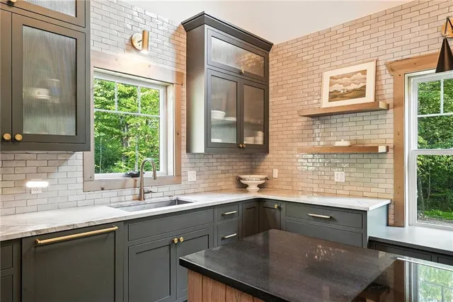 a kitchen with a sink and a window