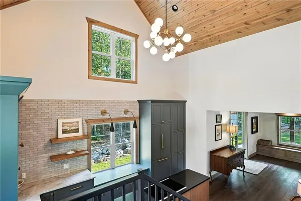 a view of a livingroom with furniture window and wooden floor