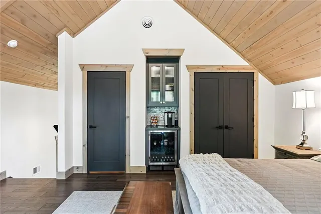 a bedroom with a bed and a dresser