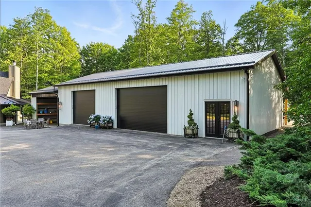 a backyard of a house with plants and trees