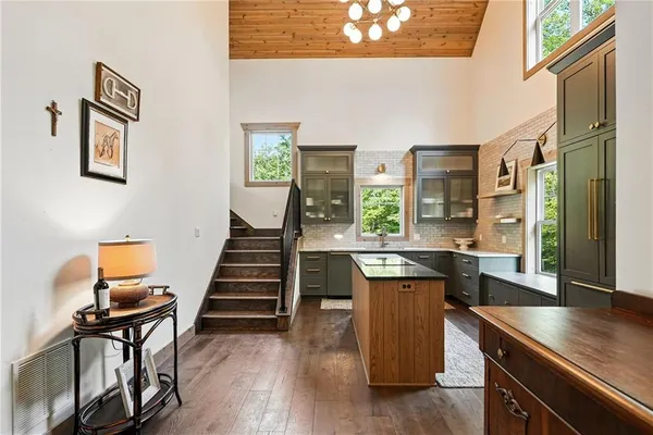 a view of a kitchen with kitchen island dining table and chairs