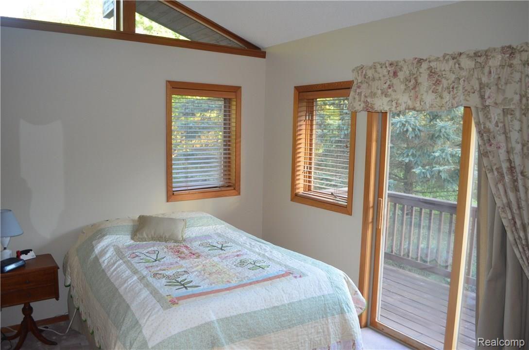 6976 Richardson Road Howell, MI 48843 - Photo 18 of 45 bedroom with walk out deck